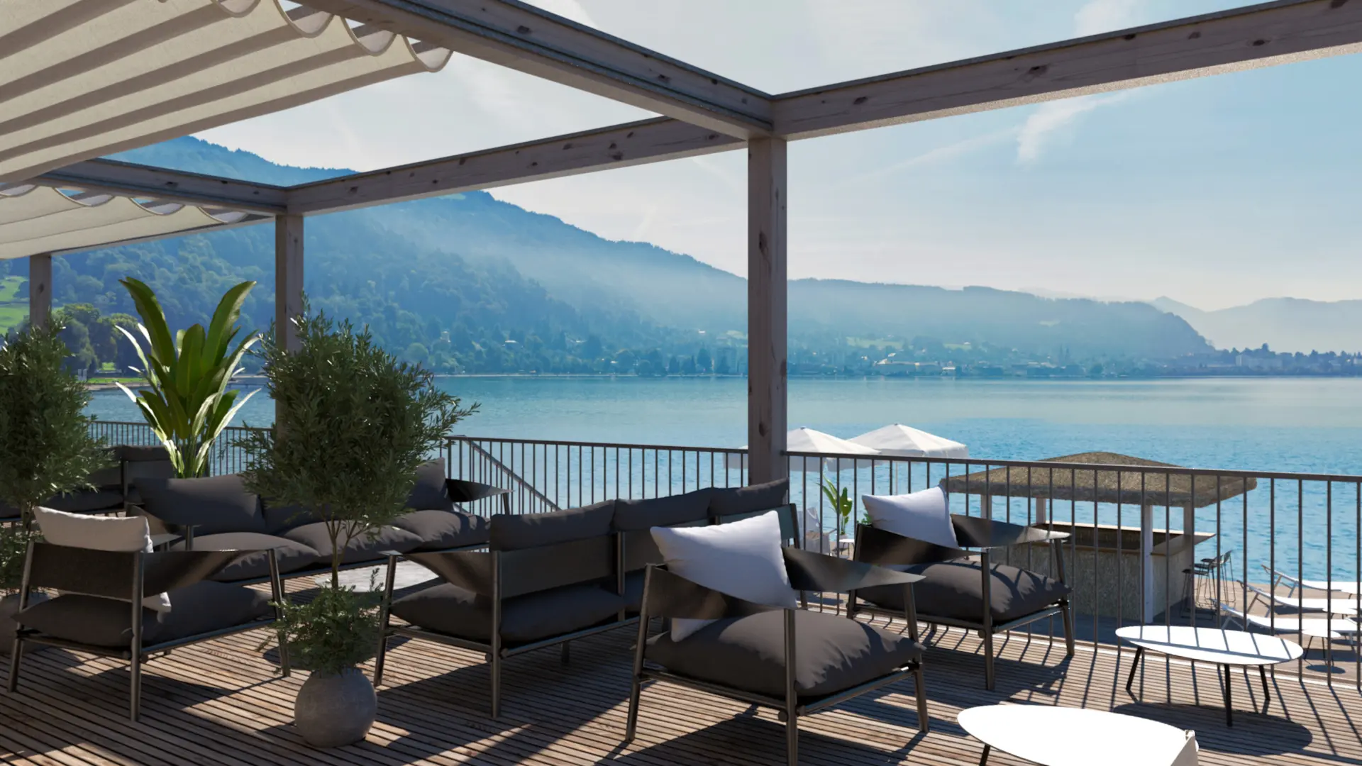 Terrasse mit Seeblick und Gartenmöbeln