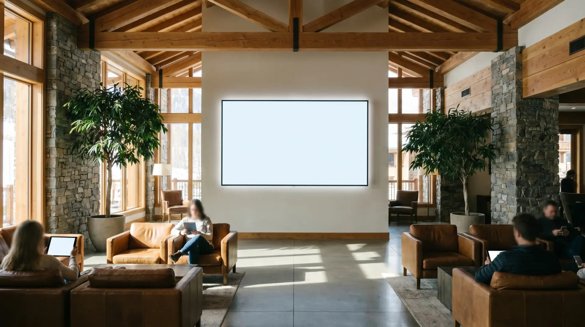 Großes professionelles Digital-Signage-Display in einer hellen Hotellobby im Alpenraum